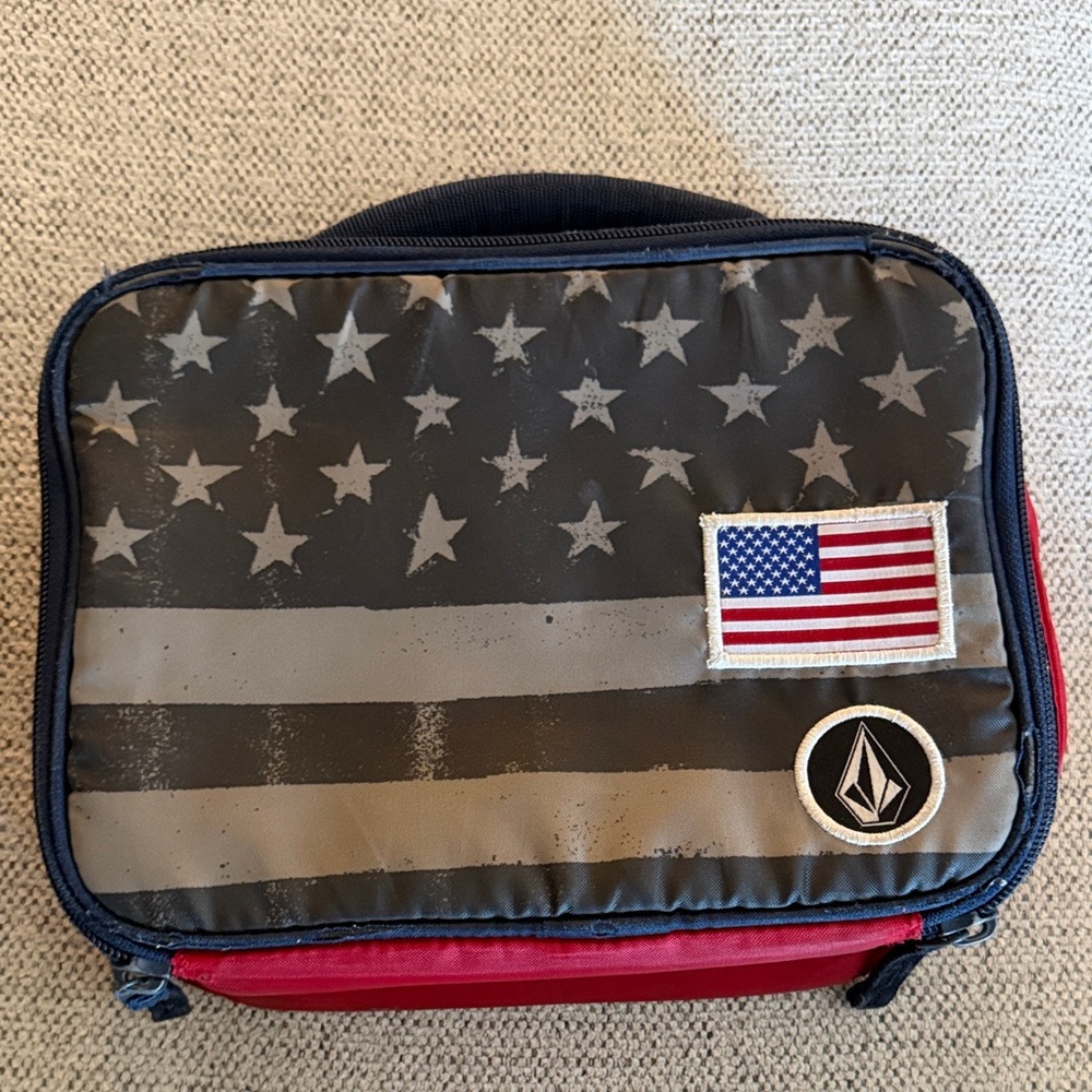 Volcom Stylish Black and Red lunch bag with flag